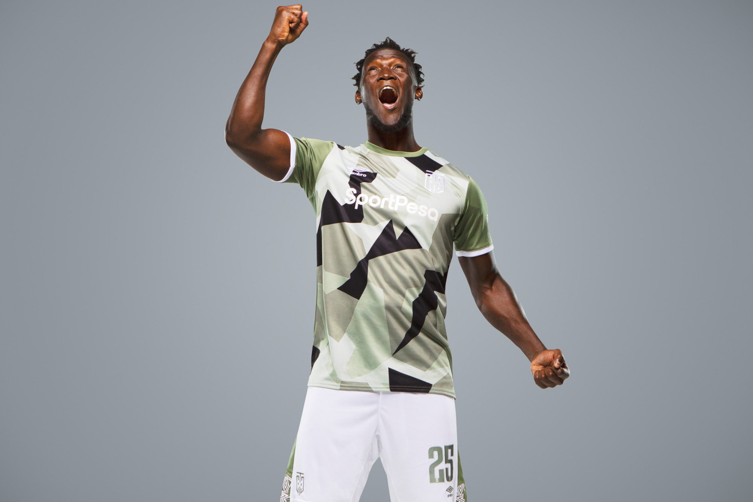 Soccer player celebrating in camo sports uniform