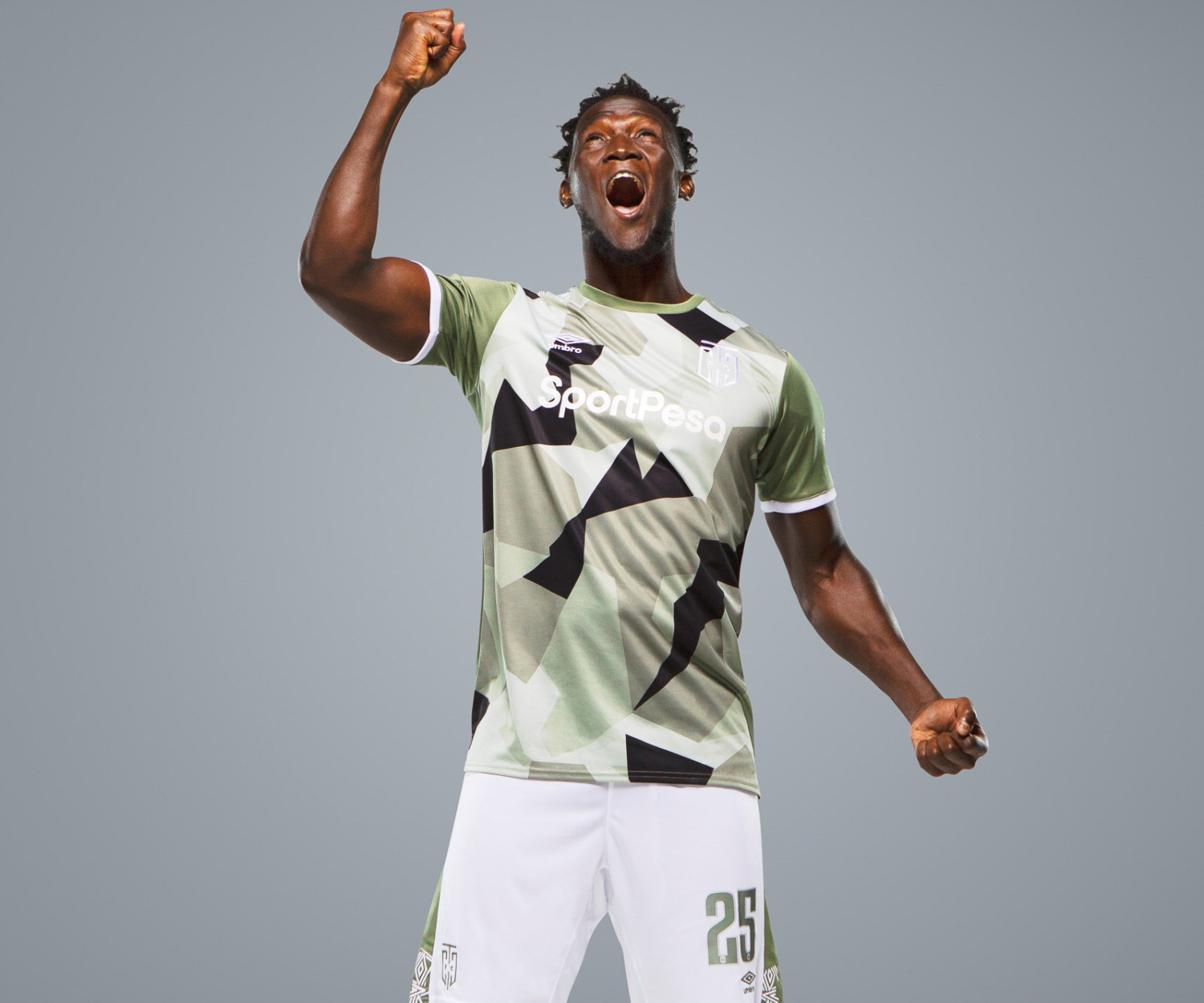 Soccer player celebrating in camo sports uniform