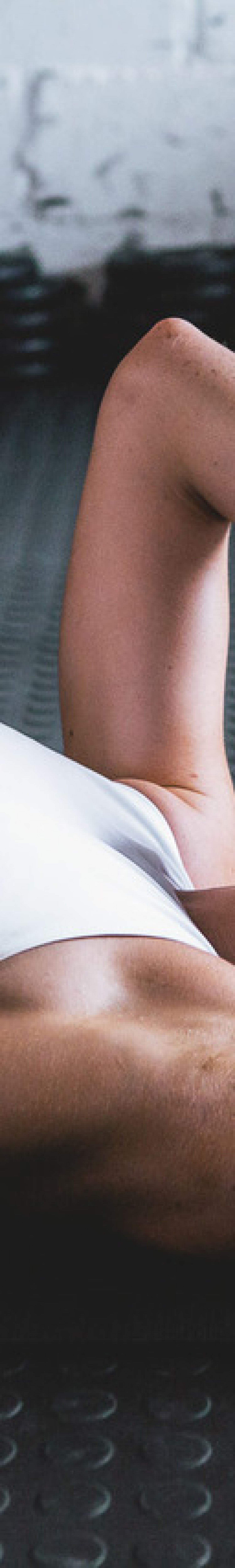 Woman resting after a workout on mat