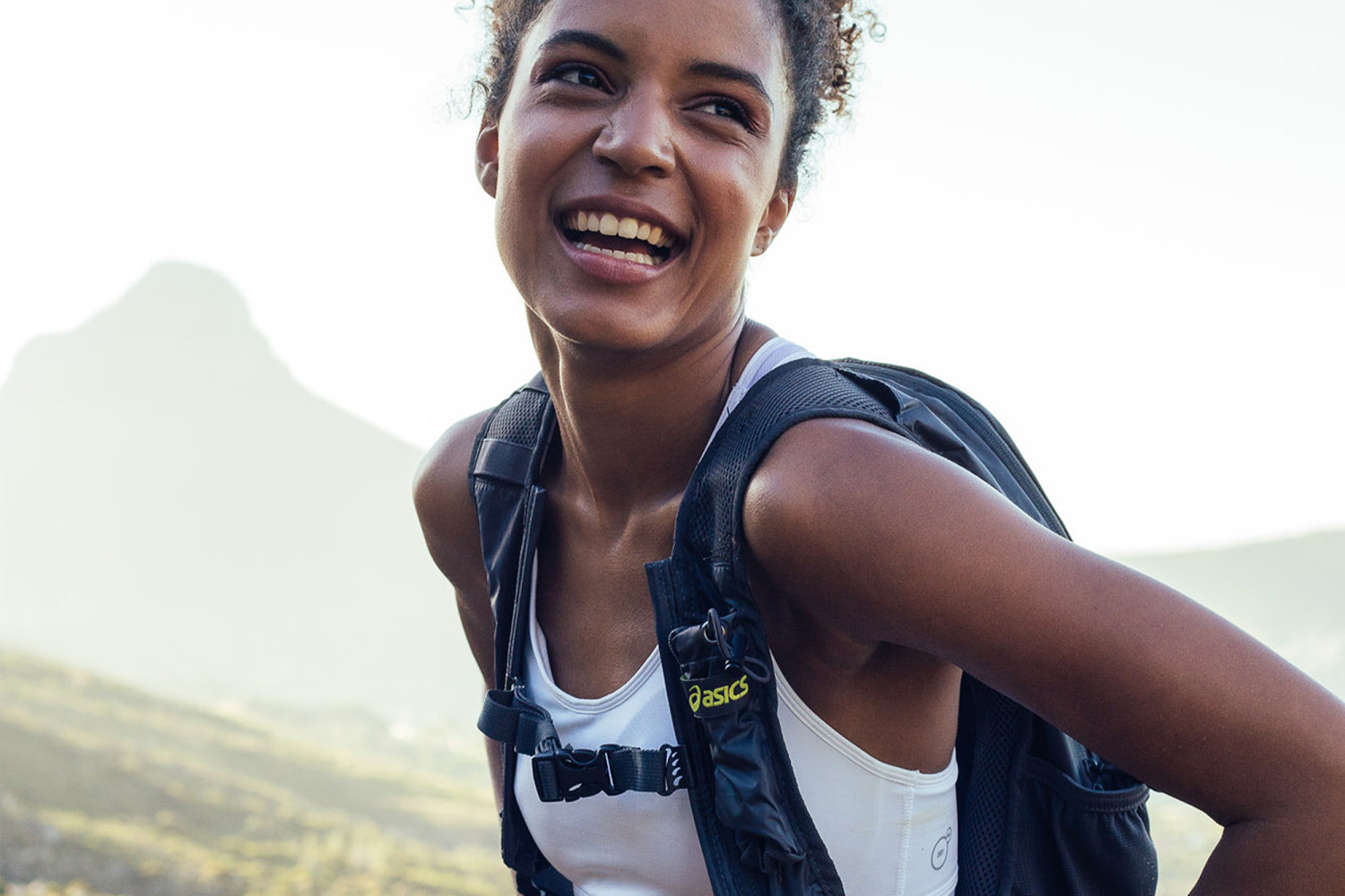 Smiling woman on hiking adventure in nature