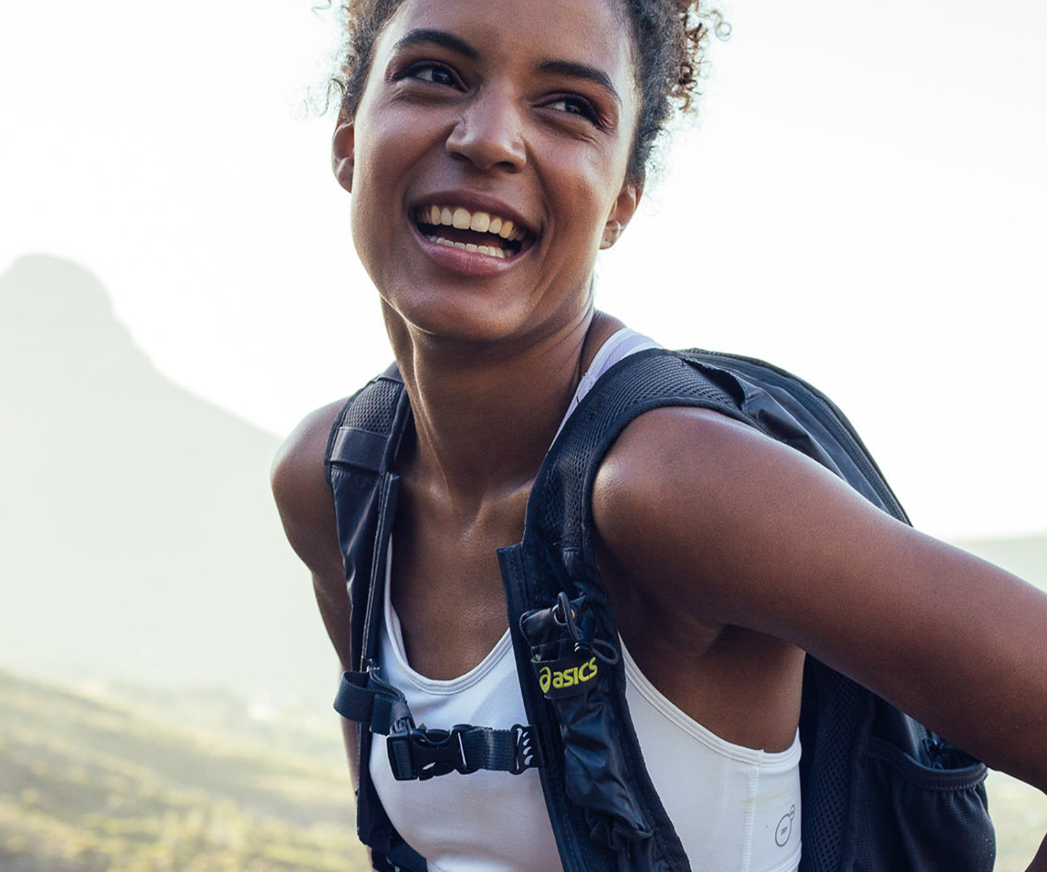 Smiling woman on hiking adventure in nature