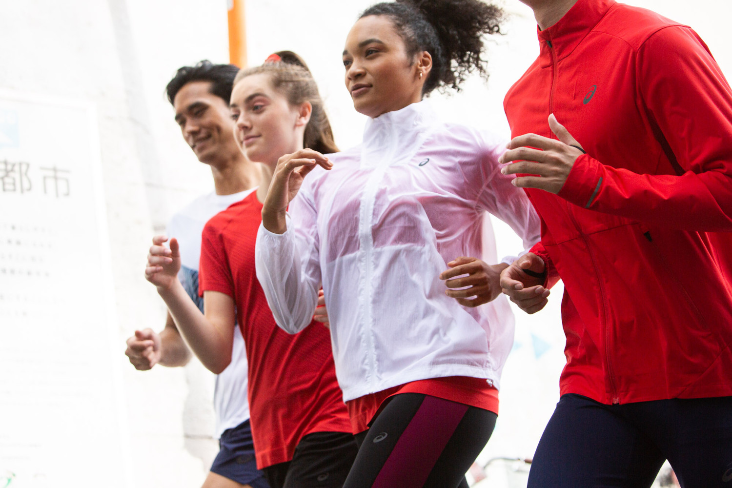 Group of people jogging in athletic wear