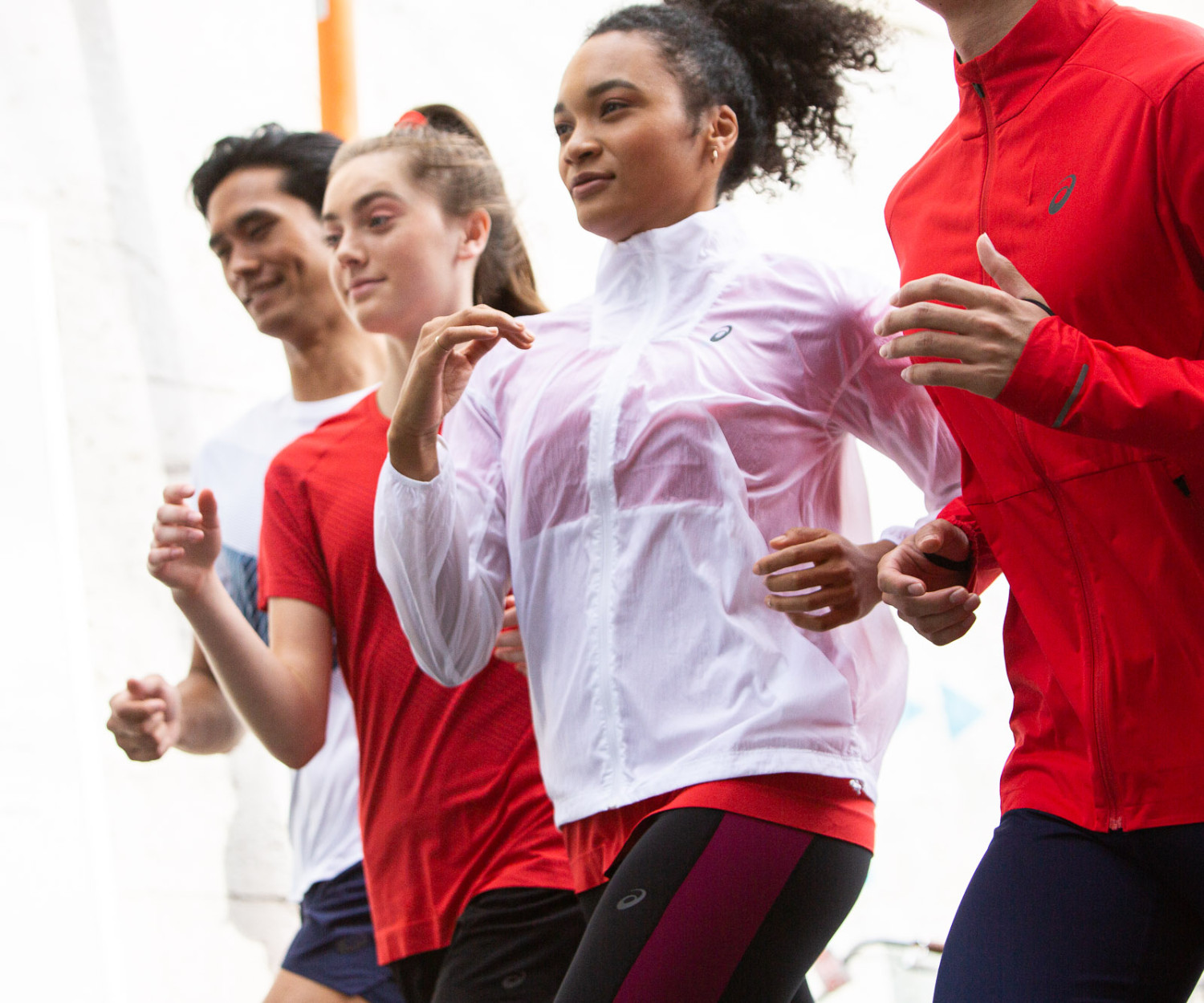 Group of people jogging in athletic wear