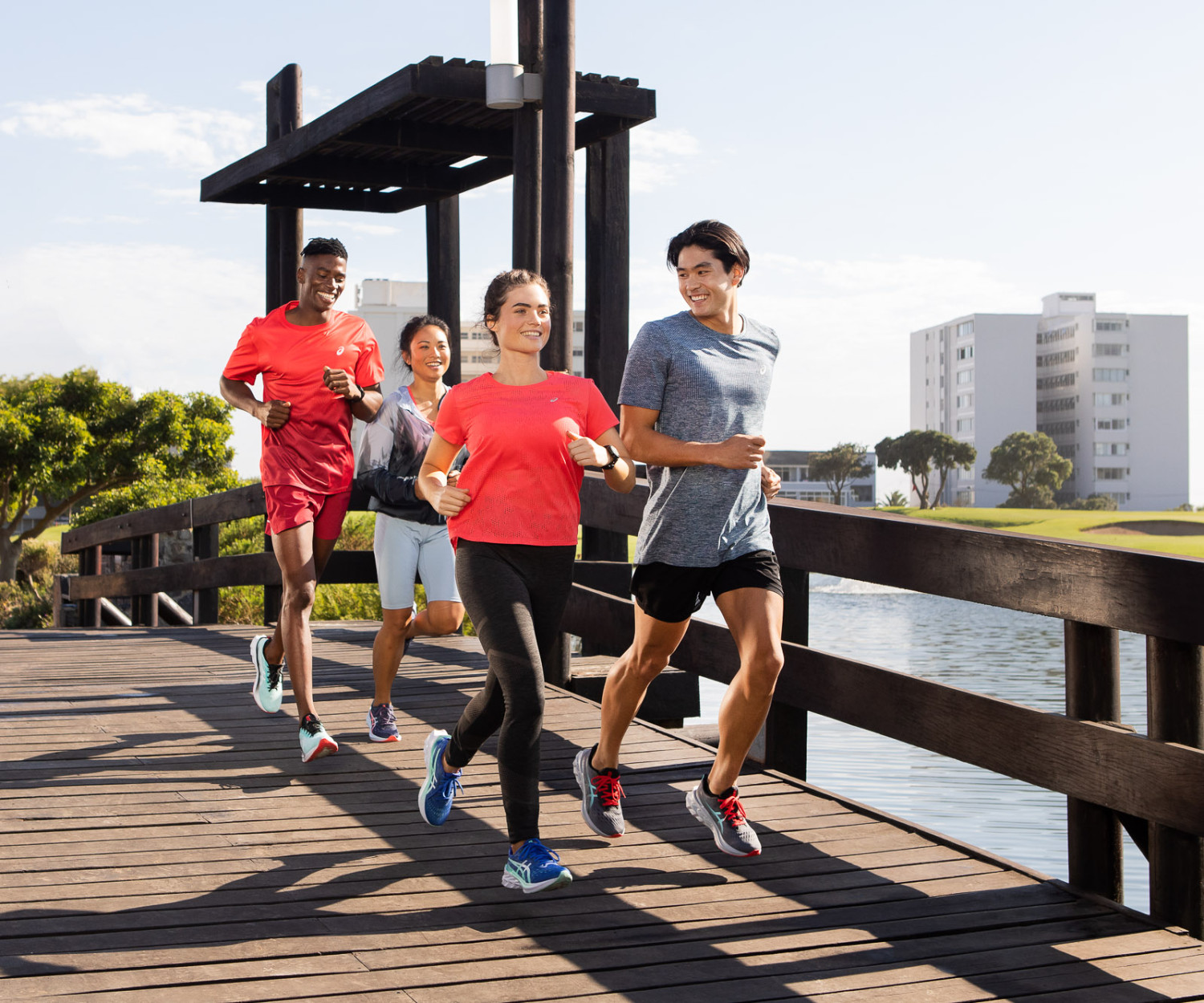 Group of people running on a bridge