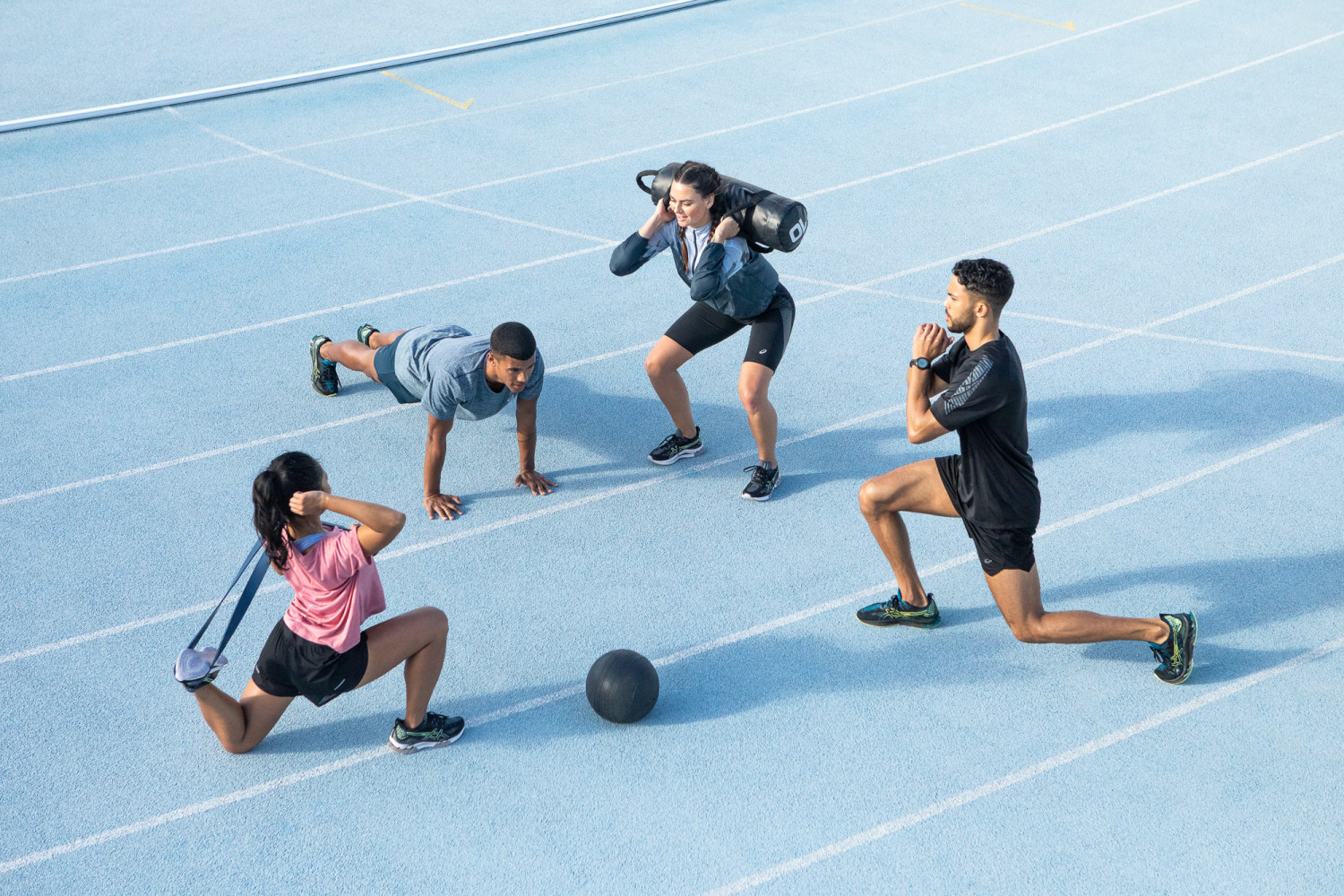 Group workout with fitness equipment outdoors