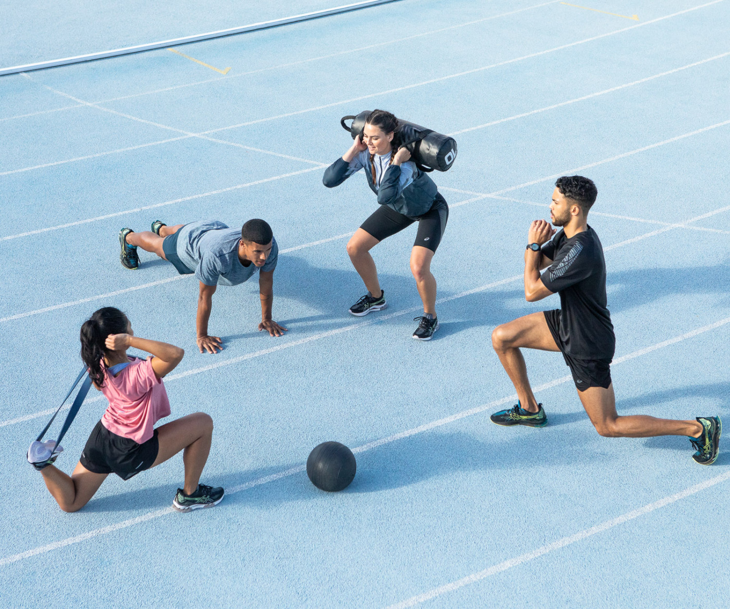 Group workout with fitness equipment outdoors