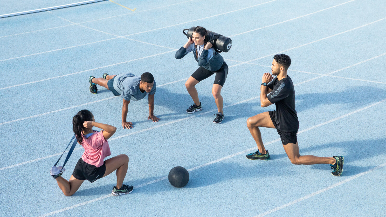 Group workout with fitness equipment outdoors