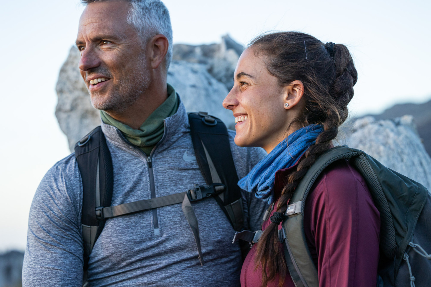 Smiling couple enjoys outdoor hiking adventure together