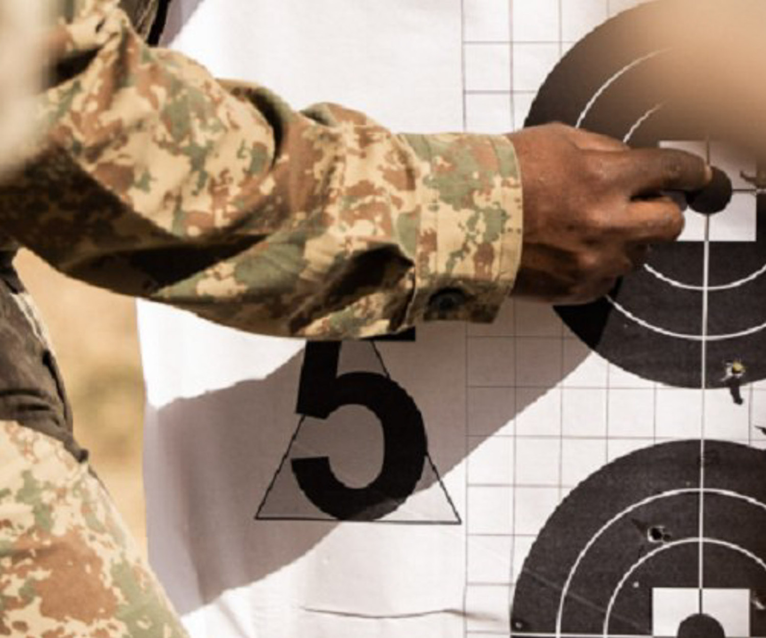 SANParks ranger at shooting range. Kruger National Park ranger training with target practice.