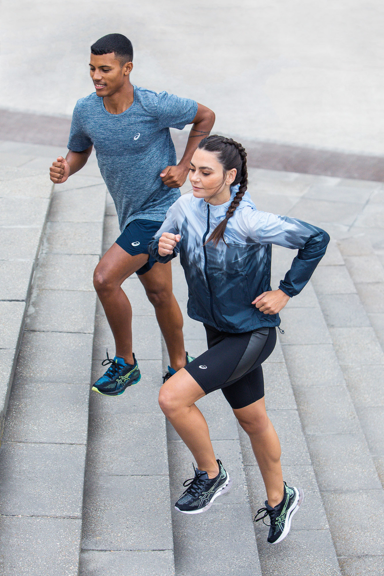 Professional sports photography capturing runners in Asics Gel-Kinsei running shoes and activewear.